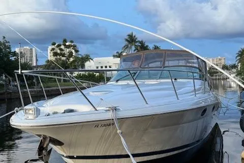 Slide: The Image of 2001 Wellcraft Martinique 3700 boat docked in a scenic marina setting. - 12