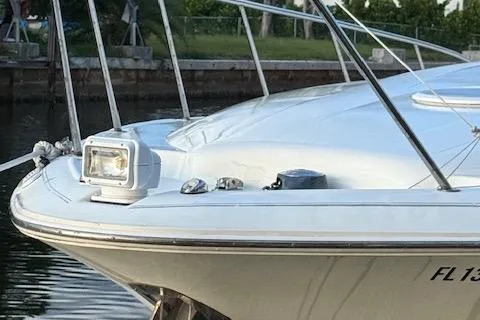Slide: The Image of 2001 Wellcraft Martinique 3700 boat, close-up of bow with spotlight, docked in marina. - 14