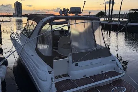 Slide: The Image of 2001 Wellcraft Martinique 3700 boat docked at sunset, featuring sleek design and spacious deck. - 17