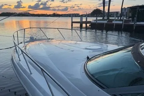 Slide: The Image of 2001 Wellcraft Martinique 3700 yacht at sunset, docked by calm waters. - 20