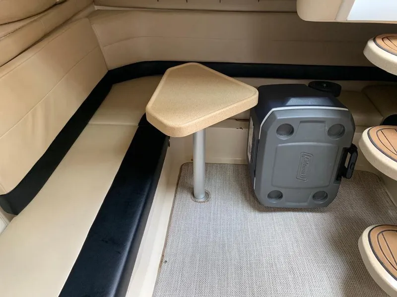 Slide: The Image of Interior of 2001 Wellcraft Martinique 3700 with seating, table, and cooler. - 26