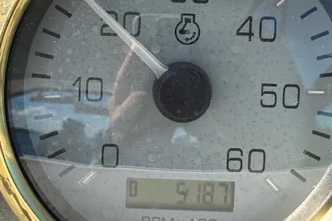 Slide: The Image of Close-up of a Wellcraft Martinique 3700 2001 speedometer showing 5187 RPM. - 40