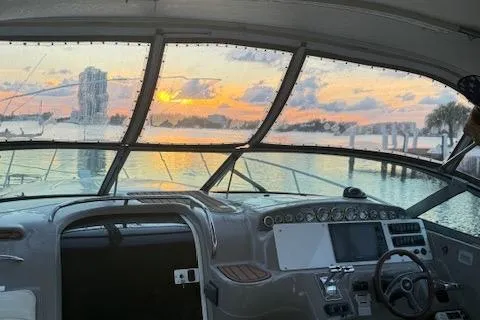 Slide: The Image of 2001 Wellcraft Martinique 3700 boat interior with sunset view through windshield. - 43
