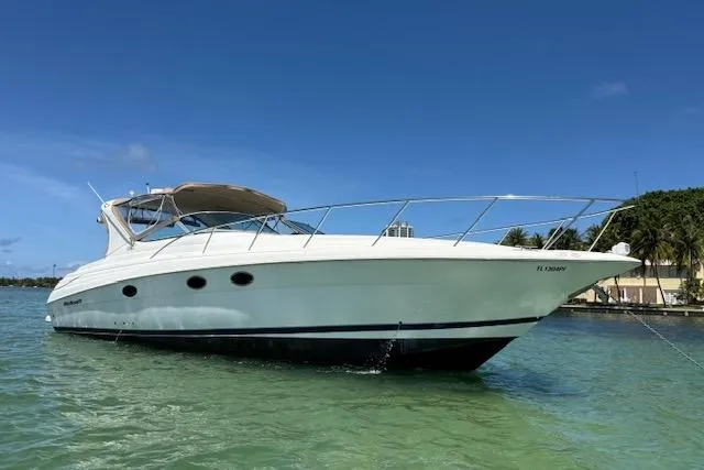 Slide: The Image of 2001 Wellcraft Martinique 3700 yacht on clear water under blue sky. - 44