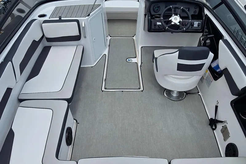Slide: The Image of 2022 Yamaha Boats AR195 interior with seating and steering console. - 9