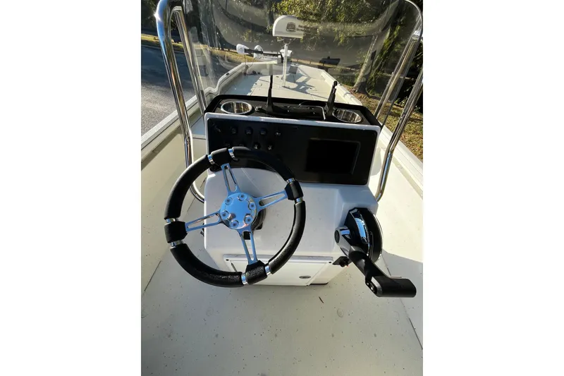 Slide: The Image of 2025 Ranger RB210 boat console with steering wheel and controls. - 5
