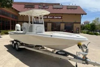 Slide: The Image of 2025 Ranger 2510 Bay boat on trailer at dealership. - 1