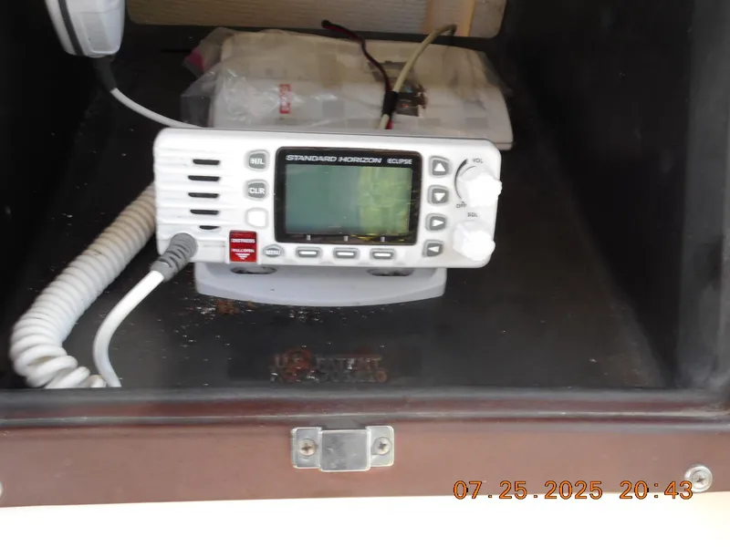 Slide: The Image of Marine radio inside a 1992 Mako 22 CC boat compartment. - 8