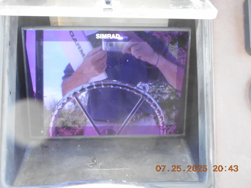 Slide: The Image of Reflection on Simrad display in 1992 Mako 22 CC boat, dated July 25, 2025. - 9