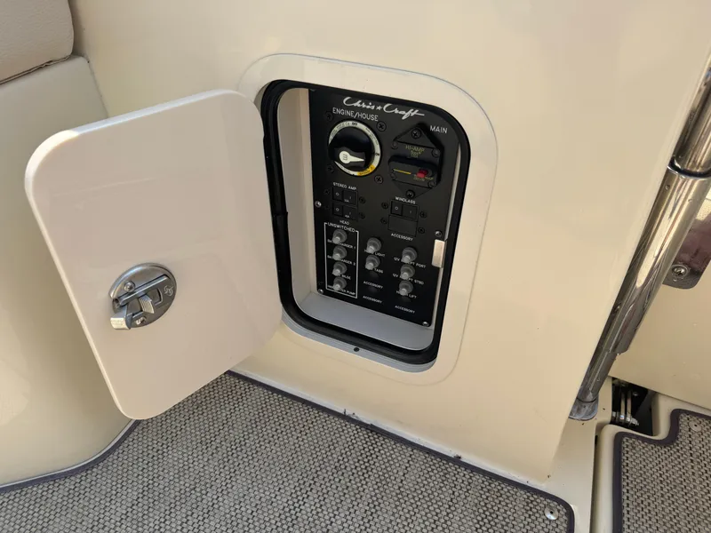 Slide: The Image of Control panel of 2022 Chris-Craft Launch 28 GT boat with open access door. - 11