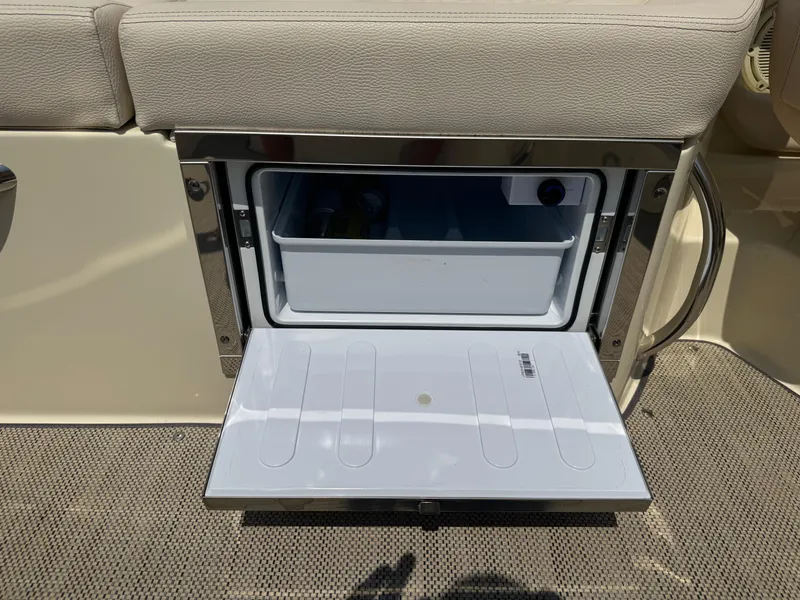 Slide: The Image of Built-in cooler on 2022 Chris-Craft Launch 28 GT boat, open with drinks inside. - 13