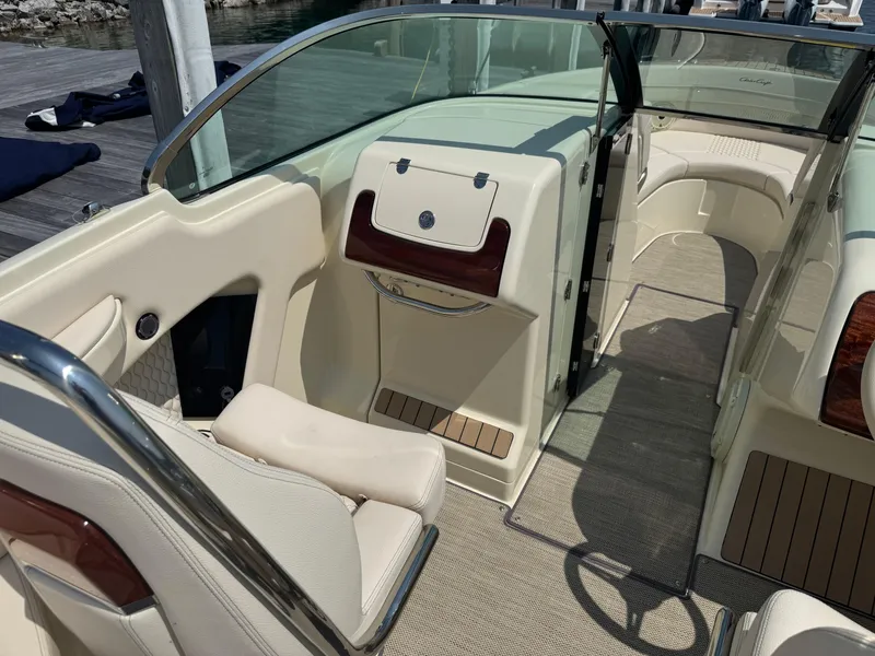 Slide: The Image of 2022 Chris-Craft Launch 28 GT interior with elegant seating and wood accents. - 14