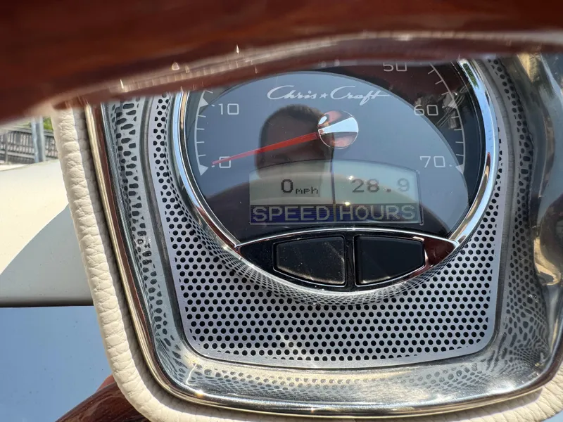 Slide: The Image of Close-up of 2022 Chris-Craft Launch 28 GT speedometer displaying 0 mph and 28.9 hours. - 24