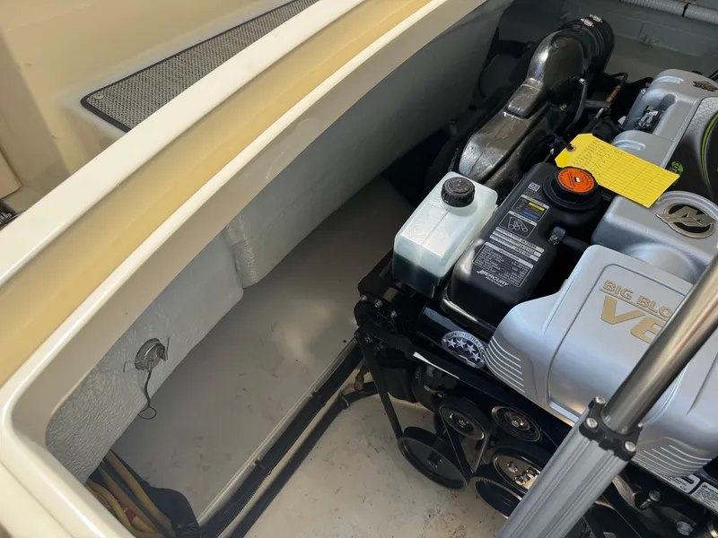 Slide: The Image of Engine compartment of a 2022 Chris-Craft Launch 28 GT, featuring a Big Block V8 engine. - 32