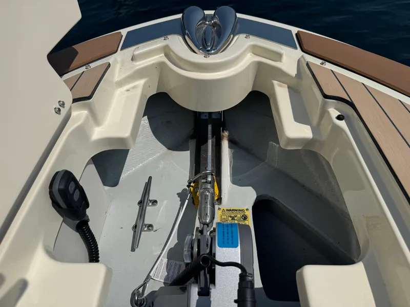 Slide: The Image of 2022 Chris-Craft Launch 28 GT boat interior, featuring anchor storage and deck details. - 34