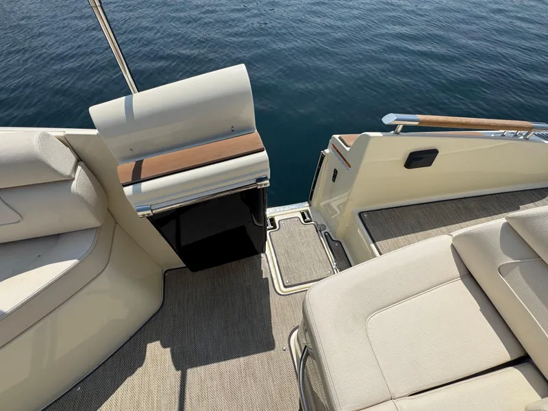 Slide: The Image of 2022 Chris-Craft Launch 28 GT interior with seating and water view. - 9