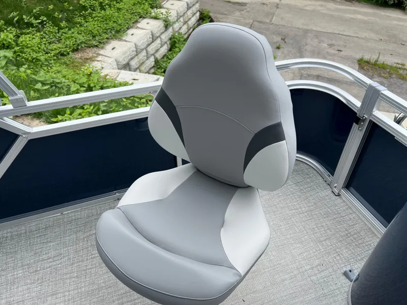 Slide: The Image of Gray captain's chair on 2026 Tahoe Pontoon LTZ 2385 RF boat deck. - 10