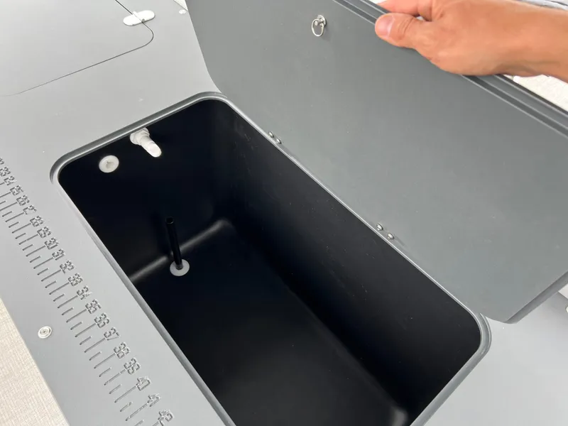 Slide: The Image of Open storage compartment on 2026 Tahoe Pontoon LTZ 2385 RF boat. - 11