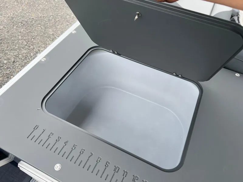 Slide: The Image of Open storage compartment on 2026 Tahoe Pontoon LTZ 2385 RF boat. - 12
