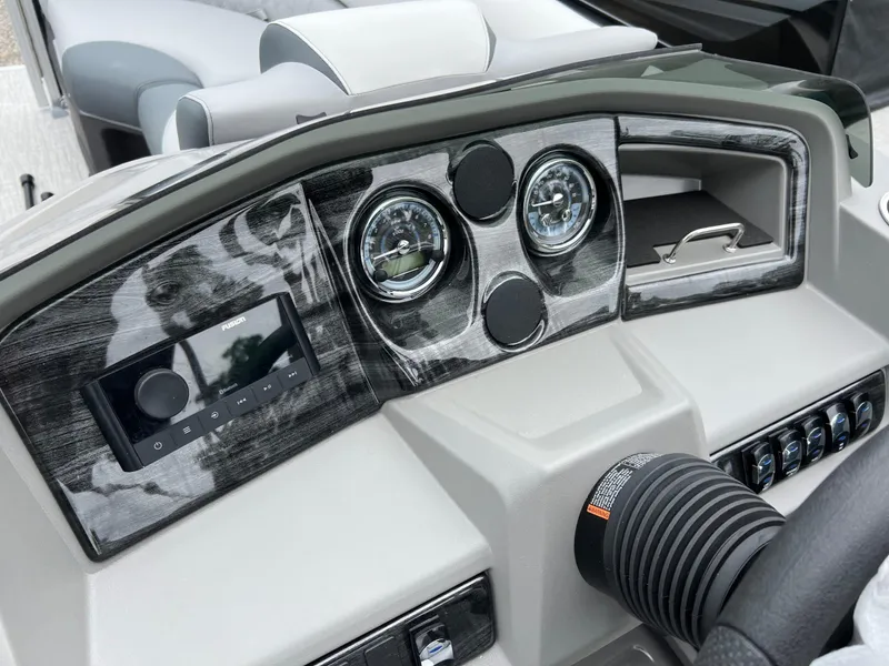 Slide: The Image of Dashboard of 2026 Tahoe Pontoon LTZ 2385 RF with modern controls and gauges. - 14