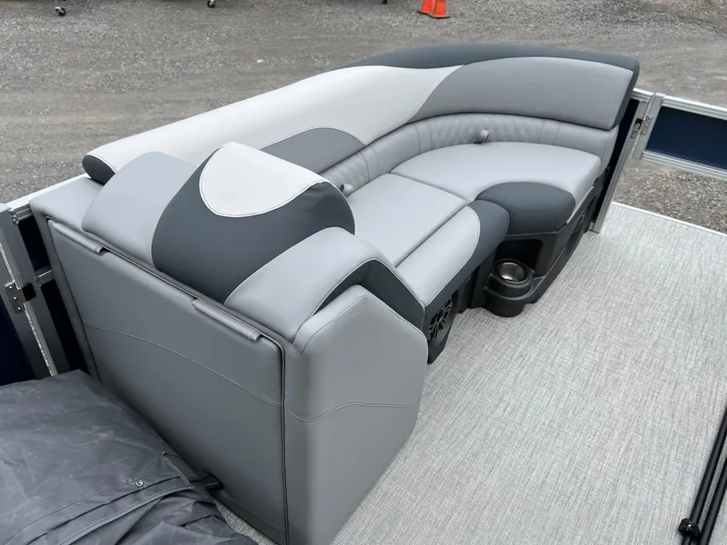 Slide: The Image of 2026 Tahoe Pontoon LTZ 2385 RF with luxurious gray seating and cup holders. - 16