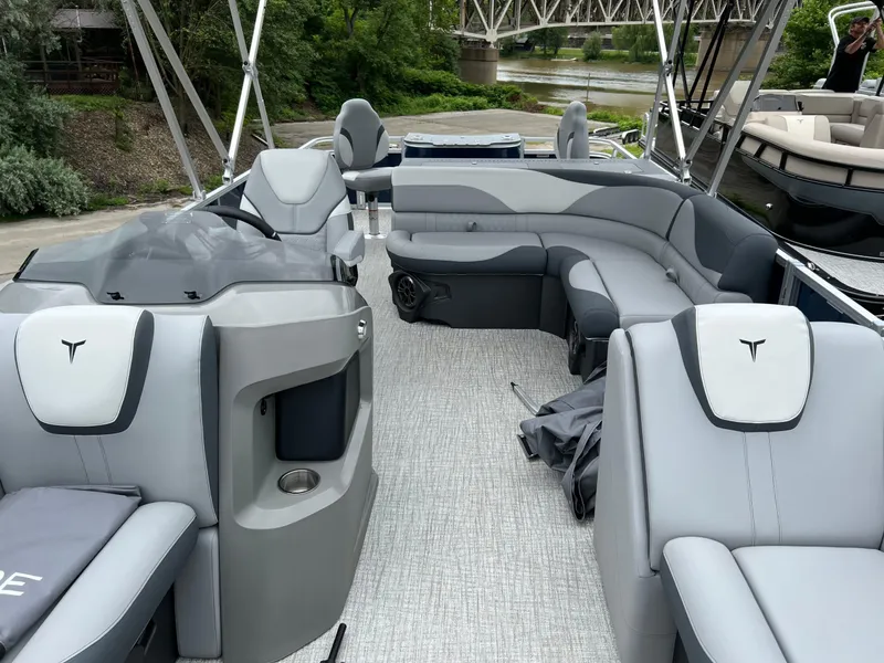 Slide: The Image of 2026 Tahoe Pontoon LTZ 2385 RF with luxurious seating and modern design on a river. - 18