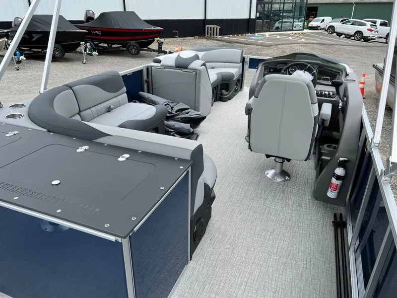 Slide: The Image of 2026 Tahoe Pontoon LTZ 2385 RF interior with gray seating and modern helm. - 20