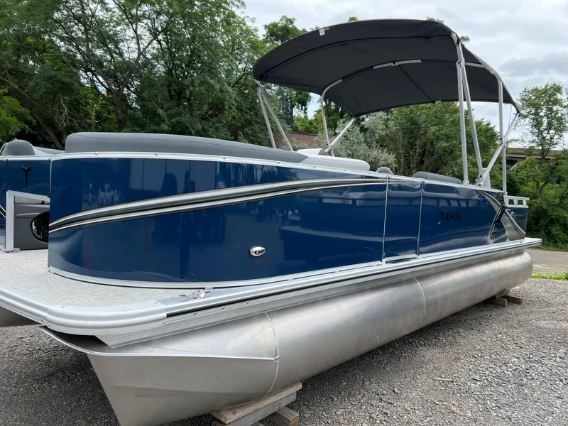 Slide: The Image of 2026 Tahoe Pontoon LTZ 2385 RF, blue exterior, parked on gravel, with canopy. - 3