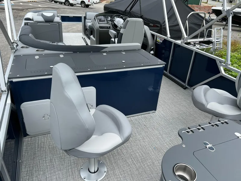 Slide: The Image of 2026 Tahoe Pontoon LTZ 2385 RF interior with gray seating and modern dashboard. - 6