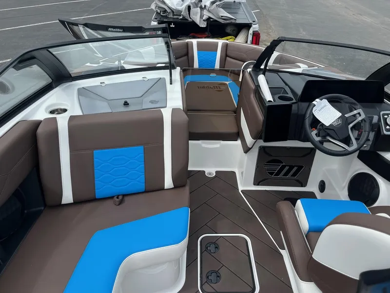 Slide: The Image of Interior of 2025 Malibu Wakesetter 23 LSV boat with brown and blue seating. - 10