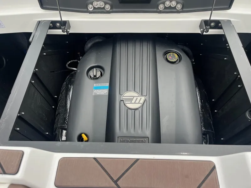 Slide: The Image of 2025 Malibu Wakesetter 23 LSV engine compartment showcasing Monsoon engine. - 13