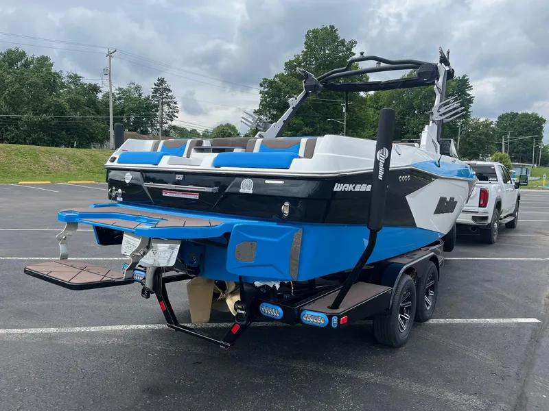 Slide: The Image of 2025 Malibu Wakesetter 23 LSV boat on trailer in parking lot. - 5