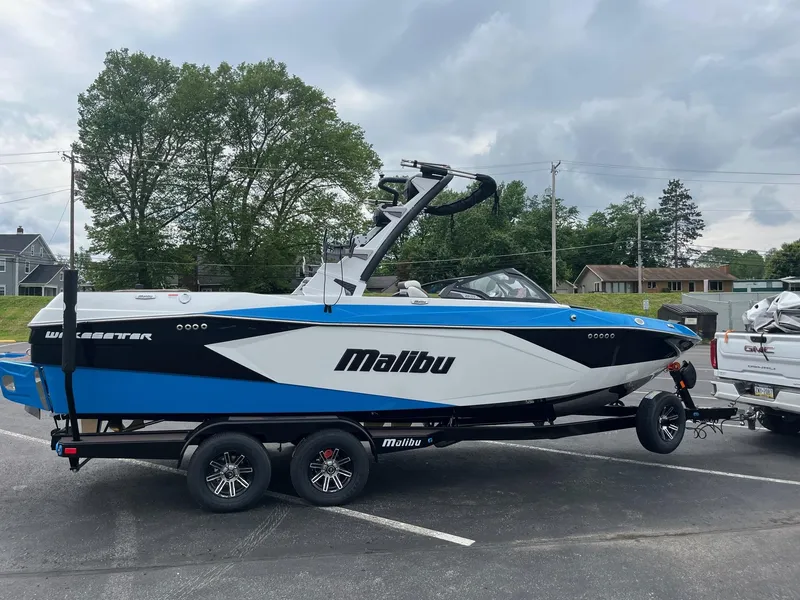 Slide: The Image of 2025 Malibu Wakesetter 23 LSV boat on trailer, parked outdoors. - 6