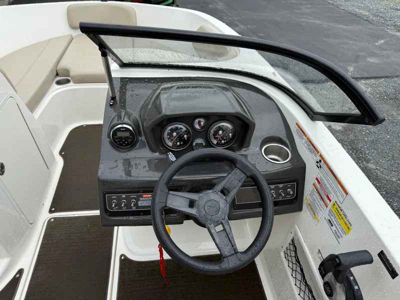 Slide: The Image of 2016 Bayliner VR5 Bowrider dashboard with steering wheel and instrument panel. - 10