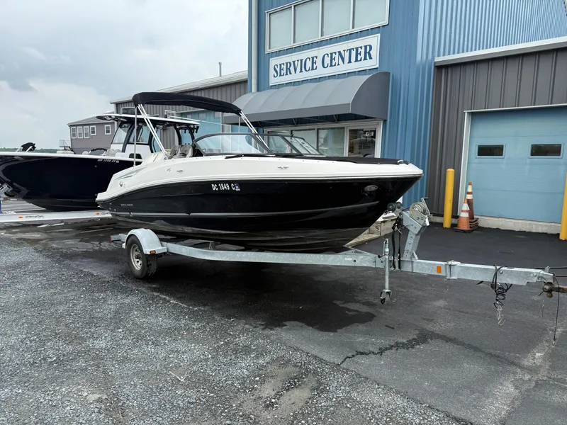 Slide: The Image of 2016 Bayliner VR5 Bowrider on trailer outside service center. - 4