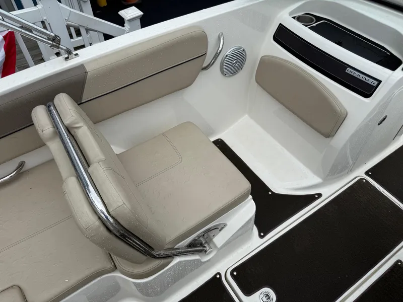 Slide: The Image of 2016 Bayliner VR5 Bowrider interior with beige seating and chrome accents. - 8