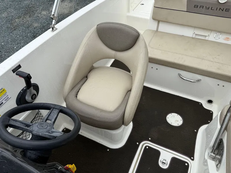 Slide: The Image of 2016 Bayliner VR5 Bowrider interior with steering wheel and seating. - 9