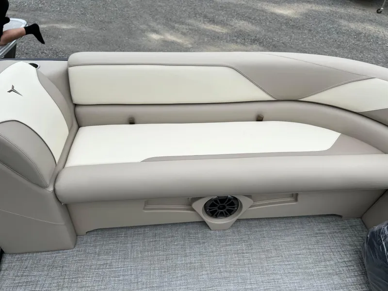 Slide: The Image of 2026 Tahoe Pontoon SPORT 85 2385 CRUISE beige and white seating with speaker detail. - 11