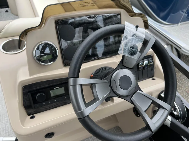 Slide: The Image of Steering console of 2026 Tahoe Pontoon SPORT 85 2385 CRUISE with modern controls and gauges. - 16