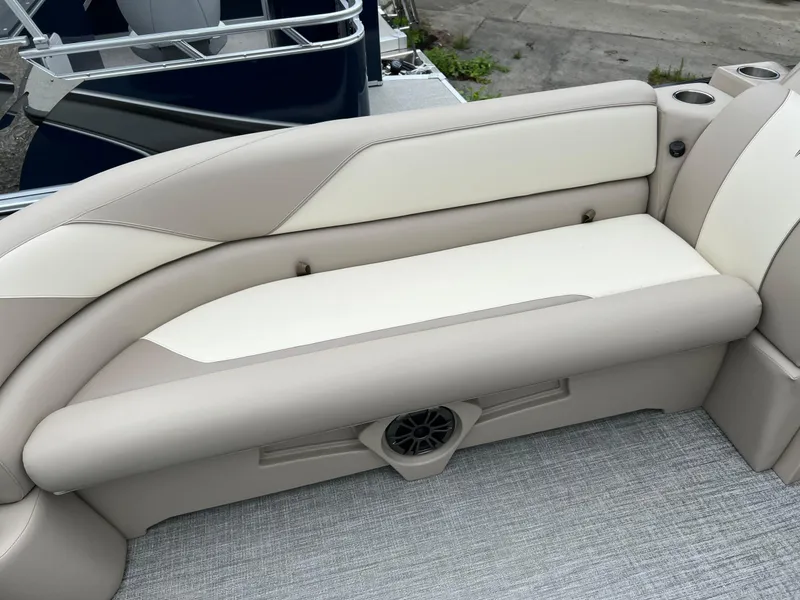 Slide: The Image of 2026 Tahoe Pontoon SPORT 85 2385 CRUISE interior seating with beige and cream upholstery. - 9