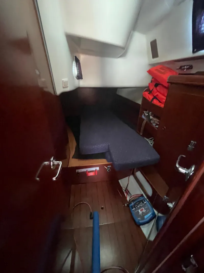 Slide: The Image of Cabin interior of 2003 Beneteau 423 sailboat with bed and storage. - 15
