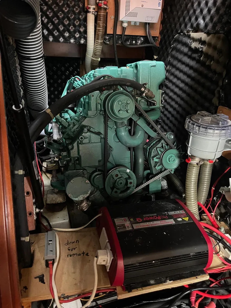 Slide: The Image of Engine compartment of a 2003 Beneteau 423 sailboat, featuring a green marine engine. - 18