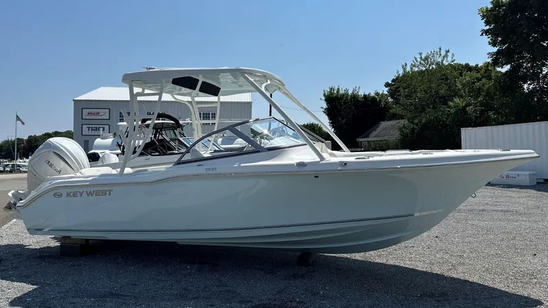 Slide: The Image of 2026 Key West 239 DFS boat displayed outdoors on gravel. - 1