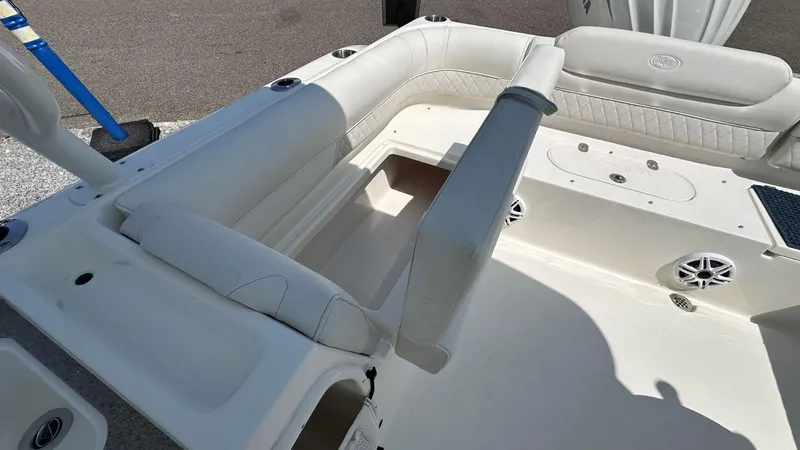 Slide: The Image of 2026 Key West 239 DFS boat interior with white seating and speakers. - 12