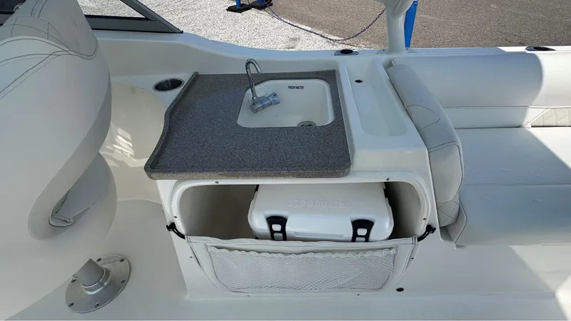 Slide: The Image of Interior of 2026 Key West 239 DFS boat with sink and storage compartment. - 14
