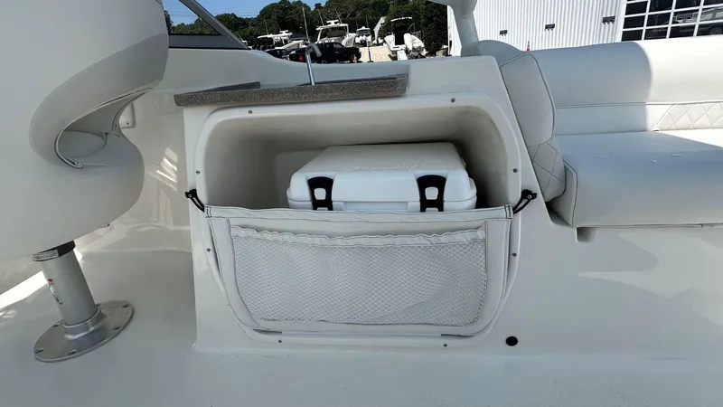 Slide: The Image of 2026 Key West 239 DFS boat interior with storage compartment and cooler. - 15