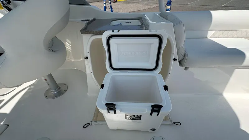 Slide: The Image of Open cooler on 2026 Key West 239 DFS boat, showcasing seating and storage area. - 16
