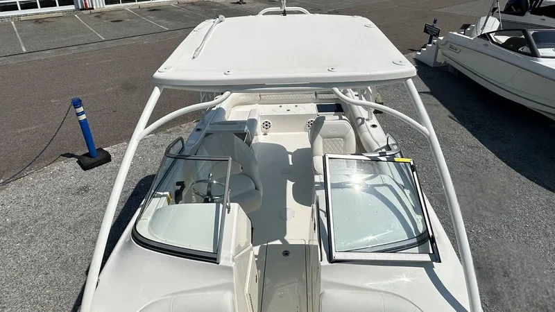 Slide: The Image of 2026 Key West 239 DFS boat with open cockpit and seating, displayed outdoors. - 42