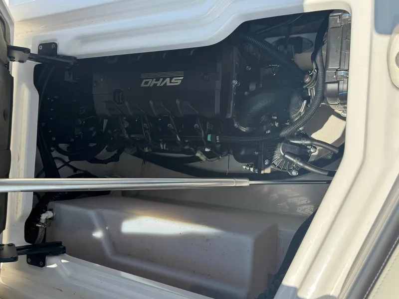 Slide: The Image of Engine compartment of 2022 Yamaha Boats 275SD, showcasing internal components and wiring. - 13