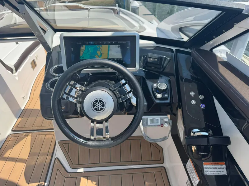 Slide: The Image of 2022 Yamaha Boats 275SD helm with touchscreen display and modern controls. - 5